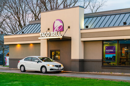 Yorkville, NY - Apr 9, 2026: The Taco Bell drive-thru in Yorkville, NY, just after sunset. Founded in 1962, Taco Bell is a subsidiary of Yum! Brands and operates over 8,200 restaurants globally. 