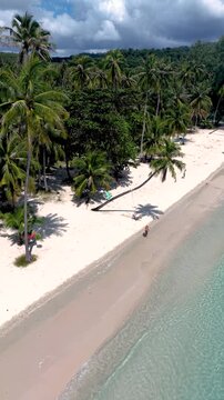Discover the stunning beauty of Koh Kood Island Thailand, where soft white sands meet crystal-clear waters. Relax on the beach under swaying palms, surrounded by lush tropical scenery.