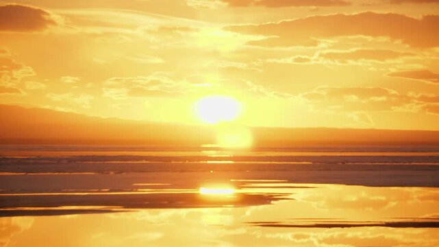 Fiery Golden Sunset Over Tidal Flats With Glossy Water Reflections, Dramatic Cloud Bands And Intense Warm Glow, Cinematic Travel Voyage Footage For Vacation Promo, Inspirational Montage And Branding