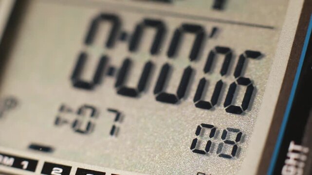 Digital timer and stopwatch running on a digital watch lcd display