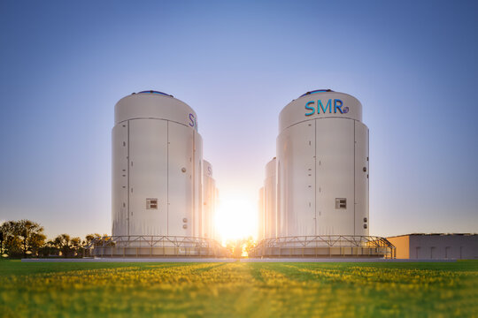 Group of smr or small modular nuclear reactors power plant against twilight sky