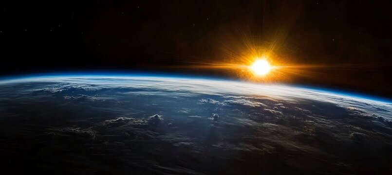 Stunning sunrise over Earth s horizon with interstellar space and countless stars in the background.