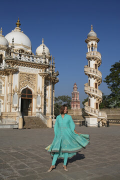 Bahauddin Maqbara, dedicated to Mahabat Khan II - Mahabat Maqbara mausoleum complex in Junagadh, Gujarat, India. Indian architecture, landmark. Beautiful building. Tourist woman in shalwar kameez
