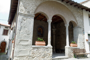 Naklejka premium Cutigliano, the medieval village in the Apennines . View of the ancient courthouse (a loggia) stand. Pistoia Tuscany, Italy