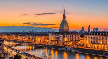 Fototapeta premium Cityscape at sunset illuminated architecture and river reflections
