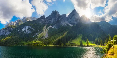 Beautiful view of idyllic colorful autumn scenery with Dachstein mountain summit reflecting in crystal clear Gosausee mountain lake. © TTstudio