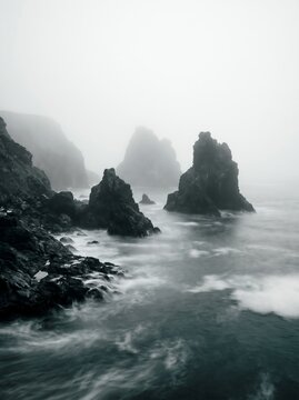 Moody Coastal Landscape with Sea Stacks in Thick Fog
