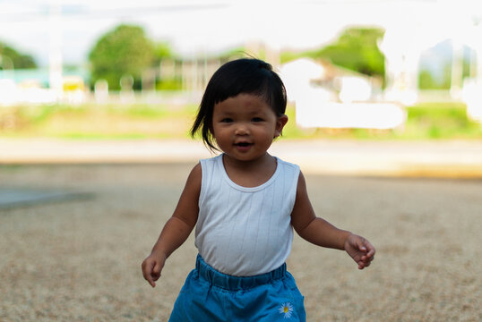 Playful child enjoys outdoor fun family park adventure joyful moment bright day