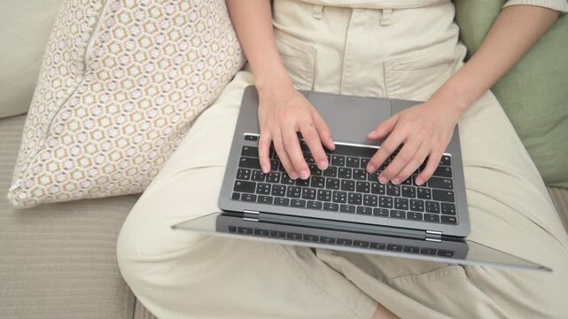 Calm focused asian woman sitting peacefully at home working remote using assistive technology as business consultant studying online for future