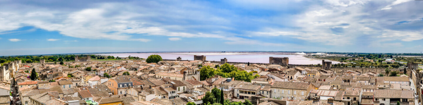 Panoramic view from the medieval city wall over the old town of Aigues-Mortes and the salines in the south of France.