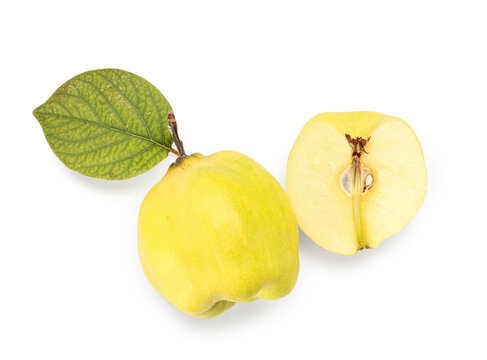 Fresh quince with cut piece and leaf on white background