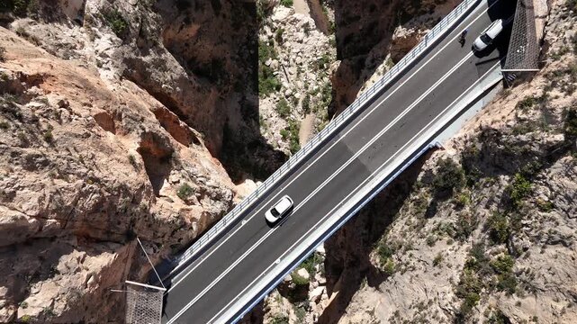 Top down drone shot flying forward above Mascarat Canyon and bridges