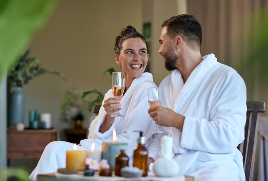Couple drinking sparkling wine at spa