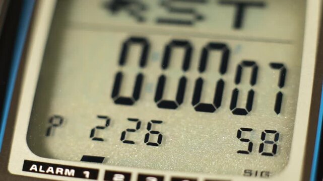 Digital timer and stopwatch running on a digital watch lcd display
