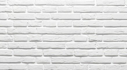 Obraz premium A close-up view showcases a textured white brick wall, highlighting the individual bricks and their mortar joints in a clean and modern aesthetic.