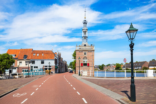 View of Accijnstoren tower and canal in Alkmaar town