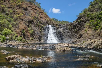 Fototapeten Wald Fluss The Wujal Wujal Falls, also known as Bloomfield Falls, located on the Bloomfield River. Bloomfield Track, Coast Road or the Cape Tribulation-Bloomfield Road, four-wheel-drive road in Far North Queensl  © pauline.mongarny