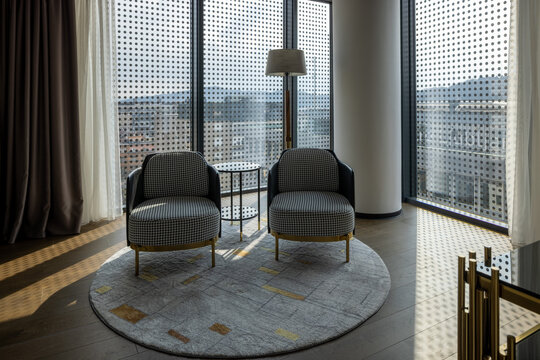 Luxury hotel room interior with armchairs for relaxation