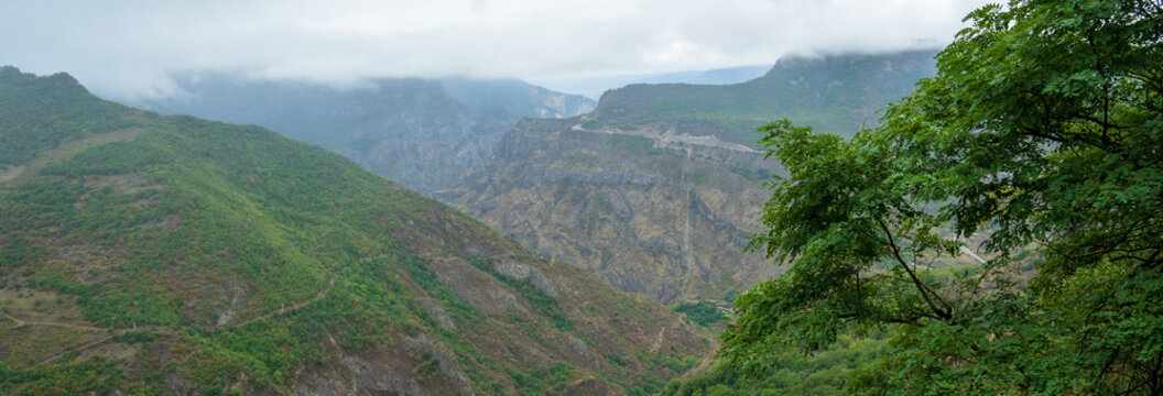 Lush green landscape with small rolling mountains, showcasing serene natural scenery, fresh grass, and peaceful countryside atmosphere.