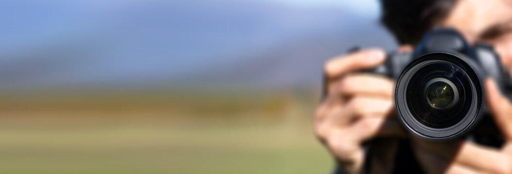 Traveler walking along scenic trail in beautiful natural landscape with mountains and forest, enjoying adventure, freedom, exploration, and peaceful outdoor journey.