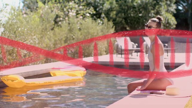 Woman sitting poolside reacting to offscreen call turning smiling with red stroke crossing for ad
