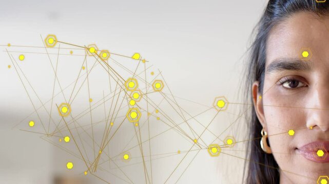 Vertical video: Mid adult woman holding gaze while yellow nodes appearing, mapping face for tech