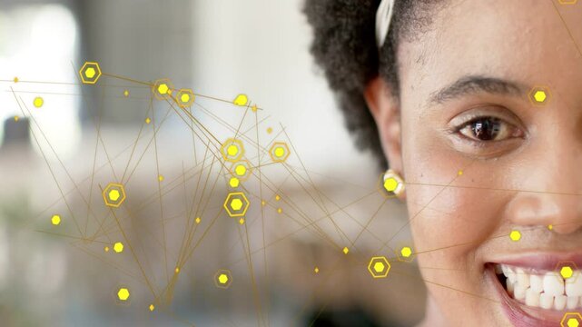 Woman smiling, animated yellow hex nodes drifting left aligning with facial points for tech mapping