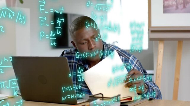 Male physics researcher comparing laptop paper while teal formulas appearing, checking calculations