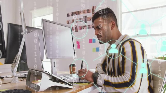 Man picking stylus sketching tablet glancing monitor tech data and network icons layering analyzing