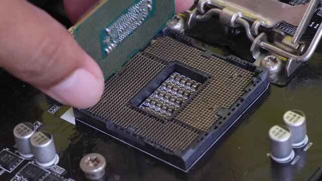 Close-up of a computer processor. The chipset on a PC motherboard's electronic circuit board. The processor hardware on a computer.