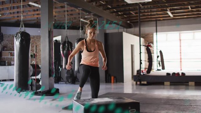 Woman placing foot on plyo box, doing step-ups for fitness, teal dotted overlay tracking knee drive