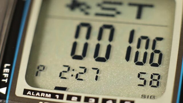 Digital timer and stopwatch running on a digital watch lcd display
