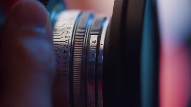 Vintage Helios lens creates dreamy swirling bokeh while focusing on vibrant neon lights