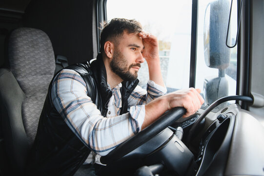 Truck driver feeling stressed and tired during long journey