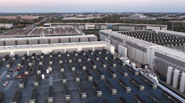 Aerial view of large data center rooftop in Ashburn, Virginia, with extensive cooling systems and server infrastructure. Modern cloud computing and AI technology hubs in Northern Virginia, usa.