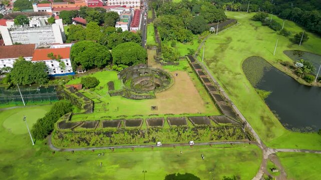 Aerial Parallax Over Intramuros Golf Course and Baluarte de San Diego Ruins Manila Philippines