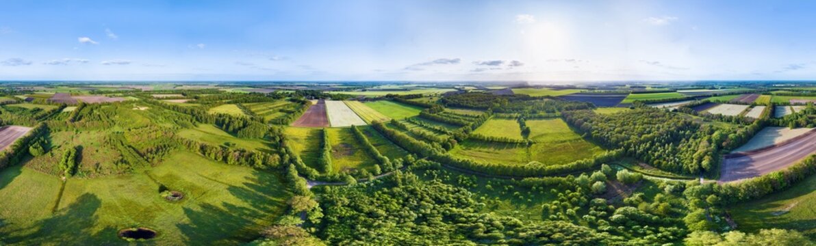 Aerial view of ancient hayfields with alder hedges surrounded by forests and cropland, in 360 degrees panorama, Mantingerbos en Mantingerweiden, Drenthe, Netherlands.