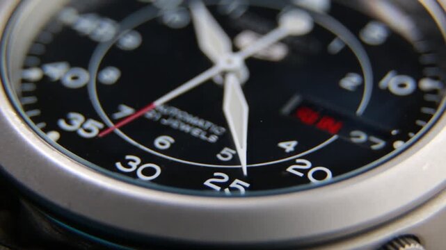 Close up of a fully automatic military watch with ticking hands
