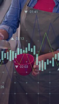 Vertical video: Barista tilting pitcher pouring milk making coffee, charts and markers overlaying