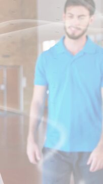 Vertical video: Man stepping forward on floor, animating glowing swirl overlay for marketing demo