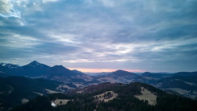 Aerial hyperlapse of mountain ridges and forests in March