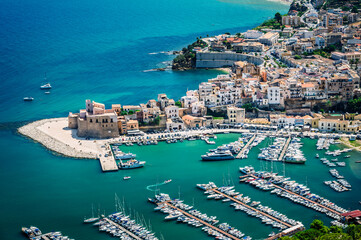 Fototapeta premium A magical summer holiday in Sicily. The Bay of Scopello, framed by its sea stacks, and the magical gulf of Castellammare del Golfo.