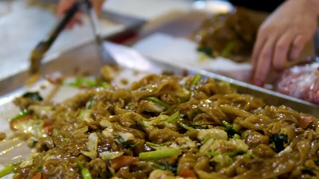 Noodles street food yakisoba noodles stir-fried with vegetable stir-fried noodles with a ladle, yogyakarta javanese noodles capture steam and movement. Perfect for food blogs, restaurants, cooking 
