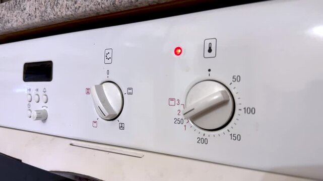 Kitchen Oven Control Settings. Homeowner Adjusting Oven Dial To Patiencefilled Baking Preparation Week