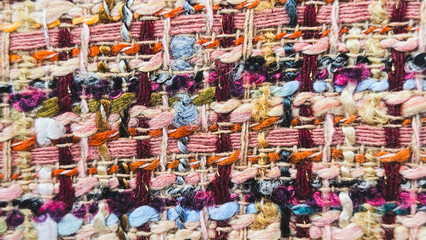 Fototapeta premium Macro texture of colorful woven tweed fabric
