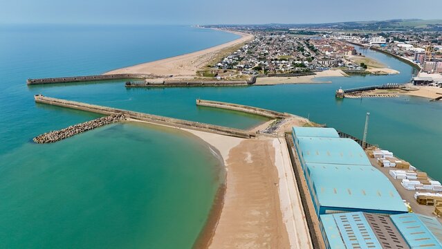 Aerial drone view of River Adur mouth at Shoreham Port and Shoreham Beach in Shoreham by Sea, Sussex