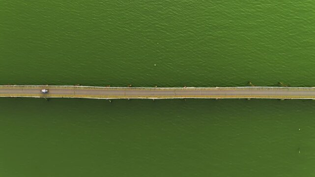 Aerial 4K of traditional Phu Kien wooden bridge crossing Cai River, Nha Trang, Vietnam
the authentic charm of rural Vietnam, highlighting the traditional engineering, peaceful tropical landscape
