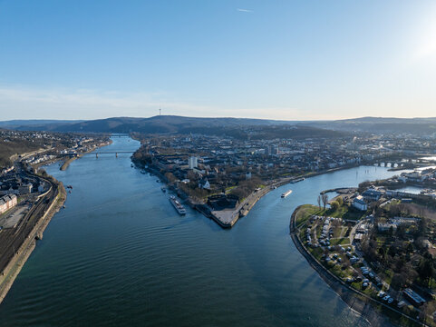 Aerial view of the confluence of two rivers meeting at Deutsches Eck, where the Mosel flows into the Rhine, Koblenz, Germany.