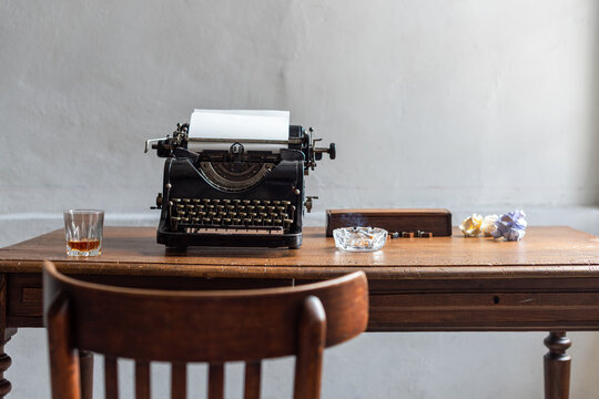 Vintage typewriter on wooden desk.