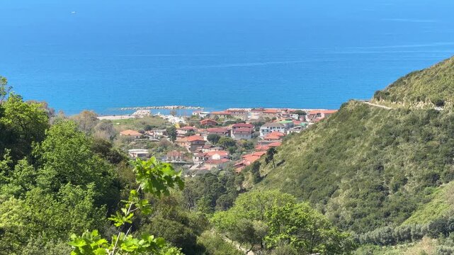 Coastal village of Agnone Cilento with blue sea and hillside landscape, Mediterranean Italy 4K